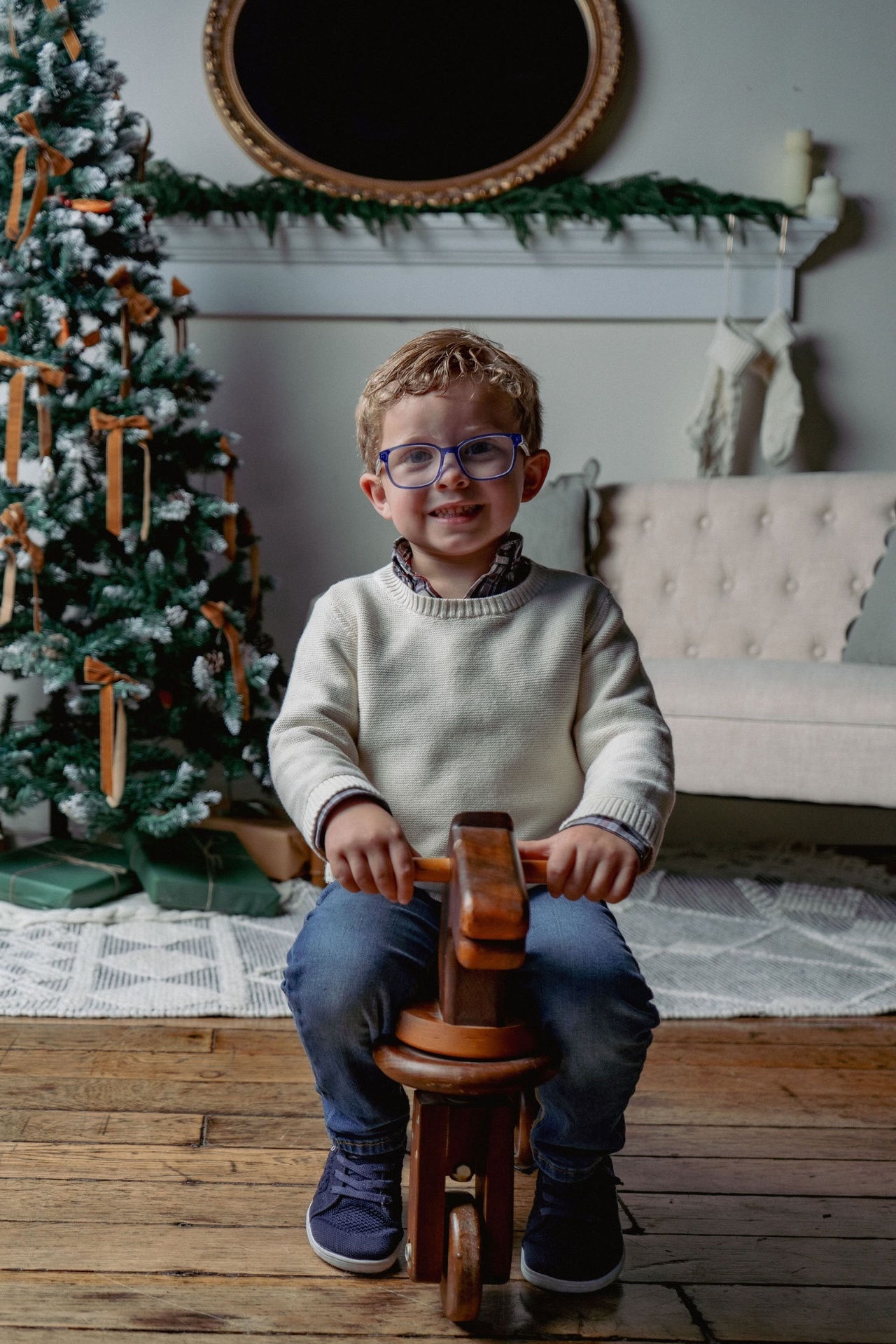Little boy by the Christmas tree